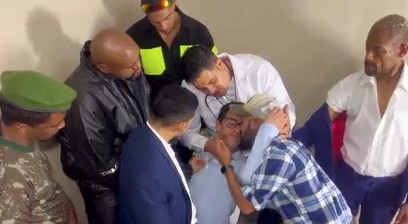 Passive woman drinks milk from eight guys.