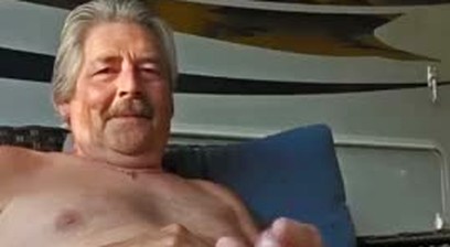 Hung old bear type naked in his garden