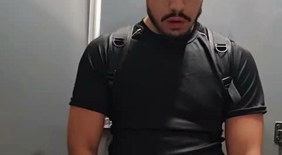 Cleaning a public toilet covered in urine