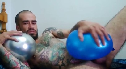 Jerking off my hard cock against inflated balloons
