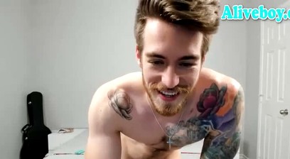 Athletic american guy with tattoos shows off his hot body