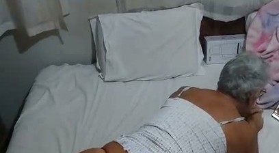 Ladysmith crossdress in bed dress wearing a sexy red panties