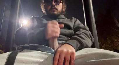 Horned up guy jerking off at a park