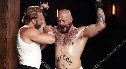 Gagged Muscle Stud Gunnar Gets Chained, Spanked and Edged by Brogan Until He Begs to Cum