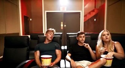 buttering his popcorn
