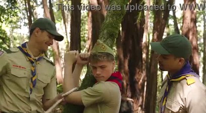 Scout boy tied up against a tree!