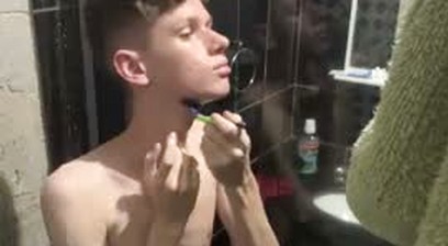 A Twink showing his body and naked at shower