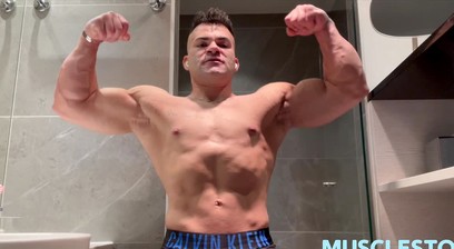 Young Alpha Bodybuilder Flexes Big Muscles