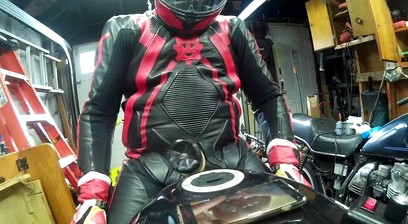Leather Biker Stud Using A Powered Masturbator