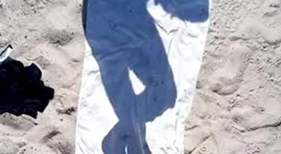 masked man having sex on the beach