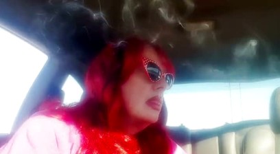 Mature Redhead Wearing LeatherGloves -Holder Smoking VS120 in Car