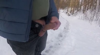 I hike through a dreamy, snowy forest in winter and masturbate my cock with a ring around it.