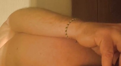 Grandpa stimulates his anus with his fingers and his special prostate dildo and it makes him wet